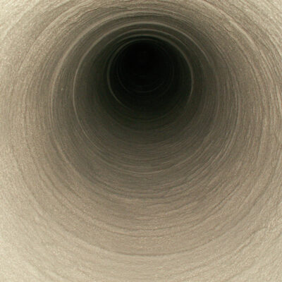 A commercial chimney with round sectional clay liners after repairs